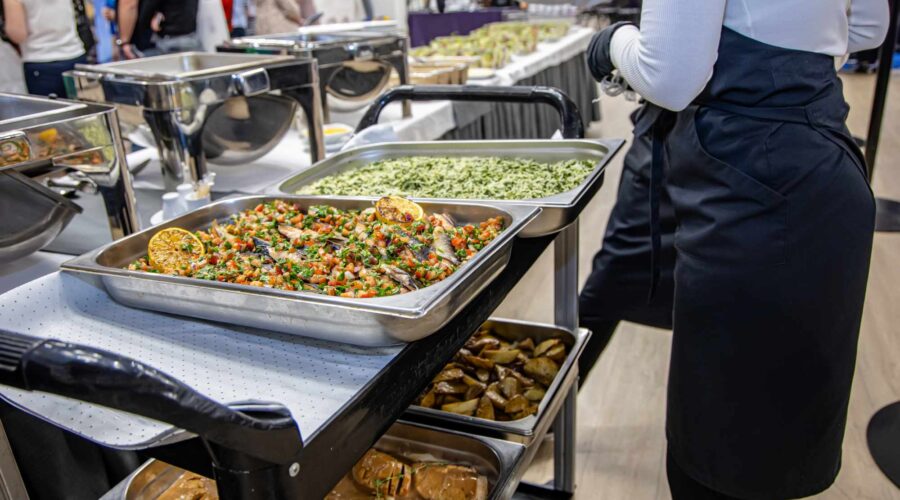 Food Stations vs. Sit-Down Dinner: The Ultimate Wedding Catering Battle
